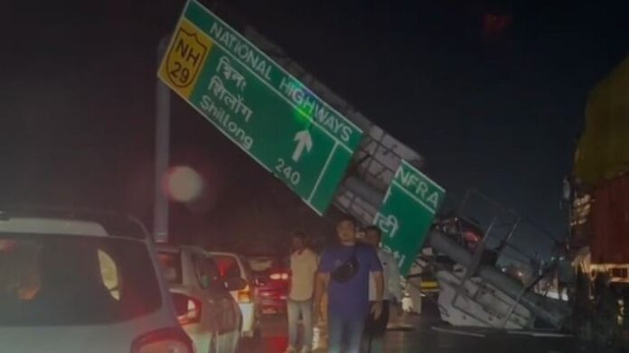 Storm Topples Roadside Hoarding on NH-29 in Assam’s Karbi Anglong, Traffic Disrupted for Hours