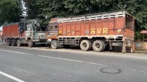 Parked Trucks on NH-715 in Nagaon Raise Questions Over Enforcement of Highway Safety Order